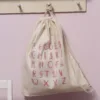 Gymtas bedrukt met het alfabet in het roze.